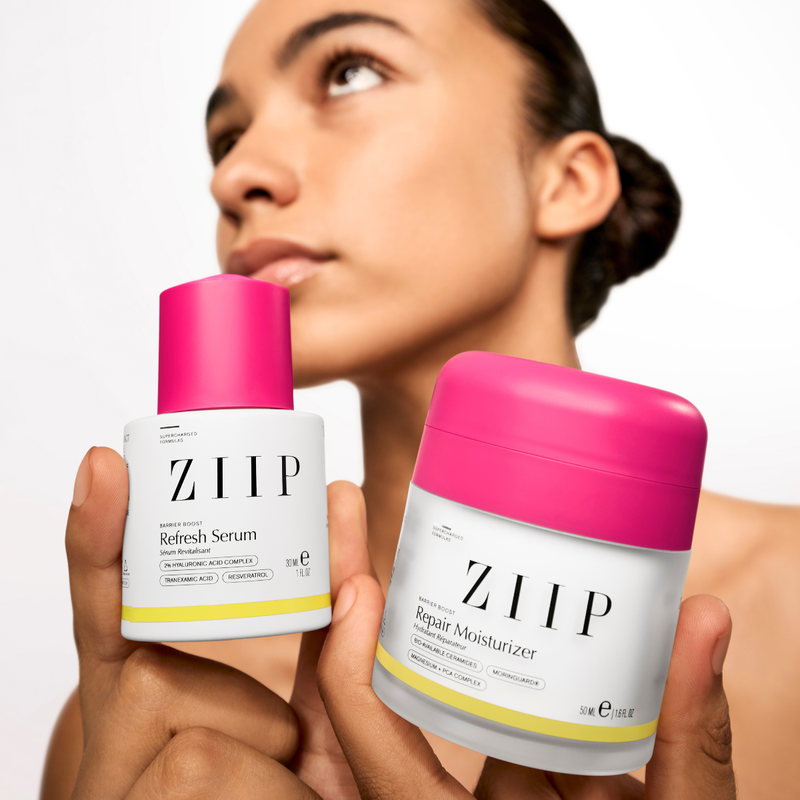 Woman holding ZIIP Barrier Boost bundle with Refresh serum and Repair moisturiser